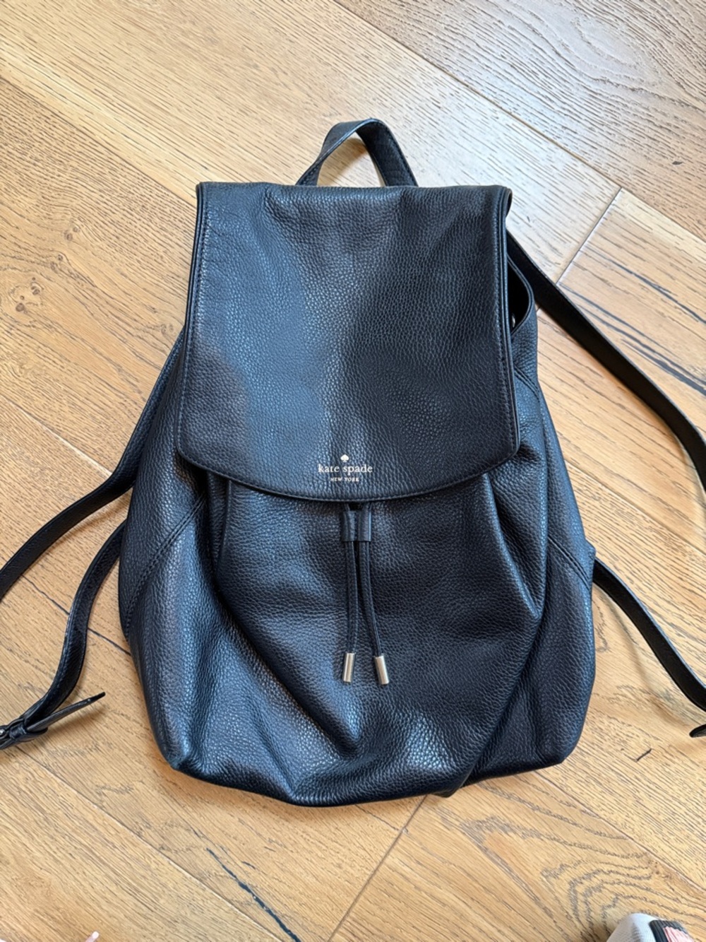 kate spade black pebbled leather flap backpack